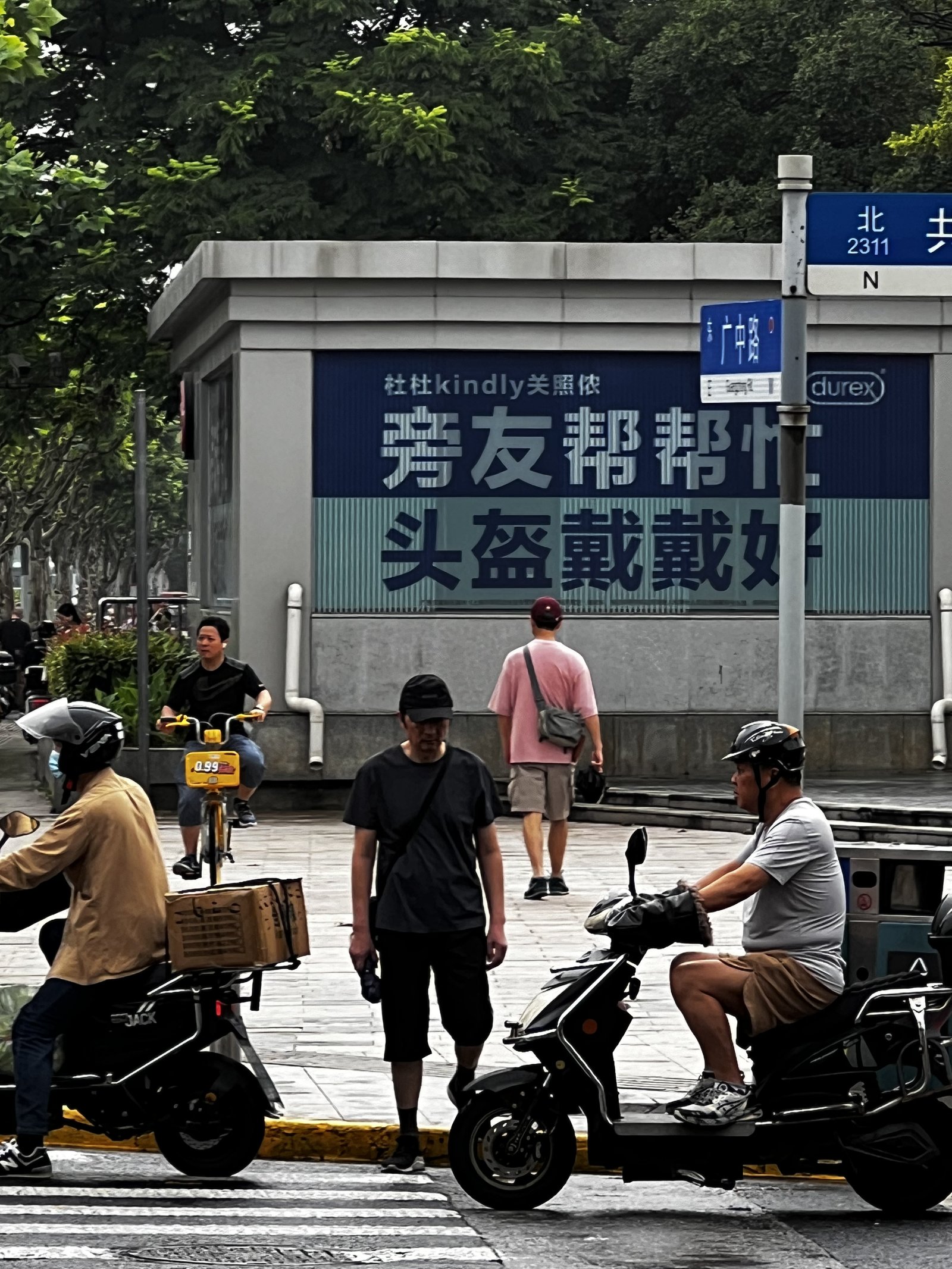 This ad by a busy subway station in Shanghai is in fact, two public safety messages in one.